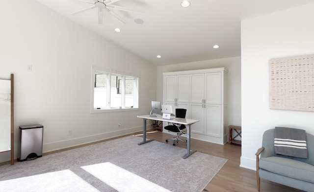 home office featuring recessed lighting, a ceiling fan, vaulted ceiling, and light wood-type flooring
