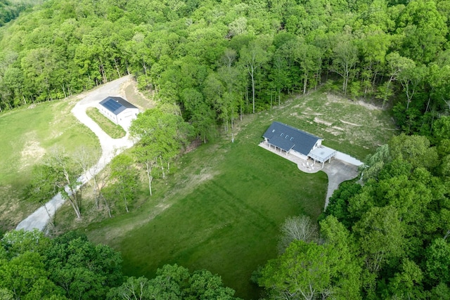 aerial view featuring a wooded view