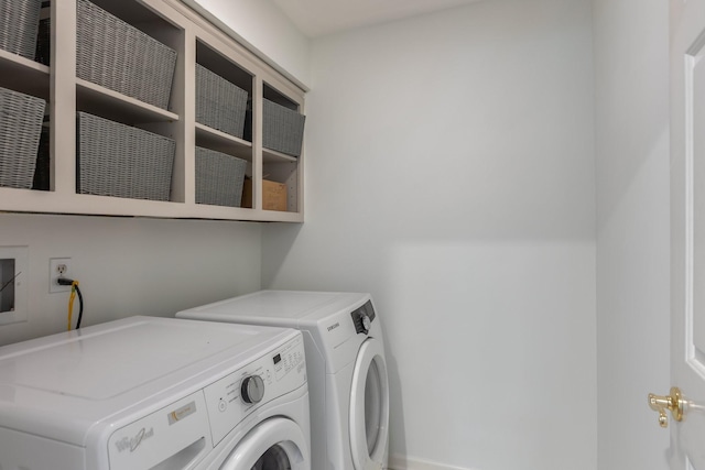 clothes washing area featuring laundry area and independent washer and dryer