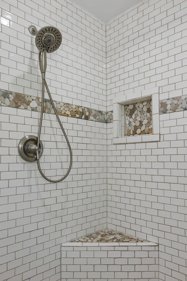 bathroom with a tile shower