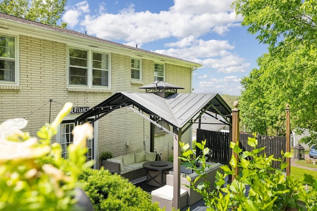 716 S Summerfield Dr, Madison, TN 37115 - rear view of house featuring an outdoor living space, fence, and brick siding