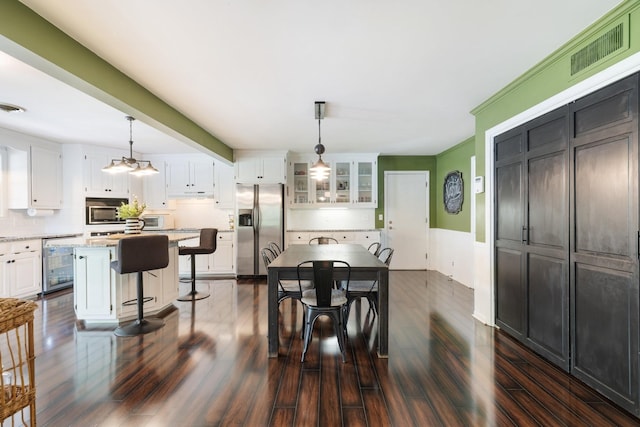 716 S Summerfield Dr, Madison, TN 37115 - dining room featuring beverage cooler and dark wood-style floors