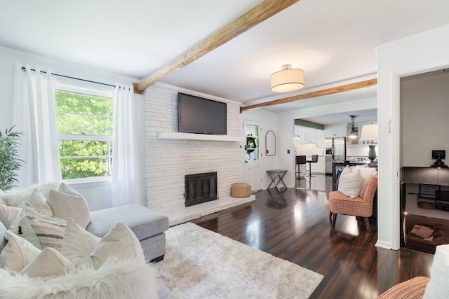 716 S Summerfield Dr, Madison, TN 37115 - living area with beamed ceiling, dark wood finished floors, and a large fireplace