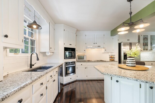 716 S Summerfield Dr, Madison, TN 37115 - kitchen with appliances with stainless steel finishes, a sink, under cabinet range hood, and white cabinetry