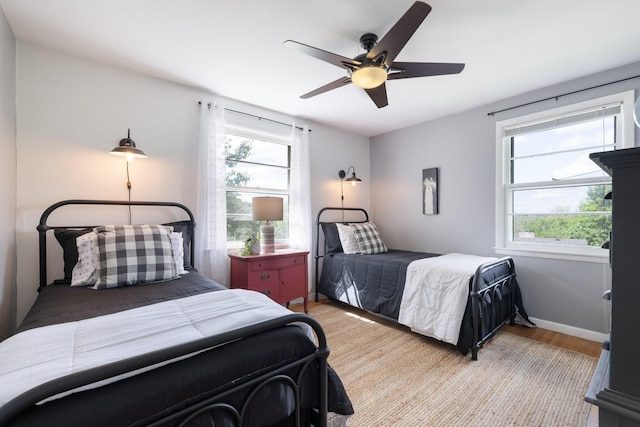 716 S Summerfield Dr, Madison, TN 37115 - bedroom featuring light wood-style floors, multiple windows, ceiling fan, and baseboards