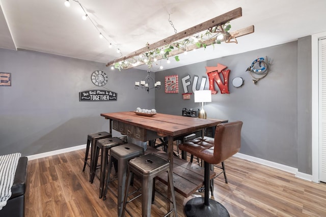 716 S Summerfield Dr, Madison, TN 37115 - dining space with rail lighting, baseboards, wood finished floors, and a chandelier
