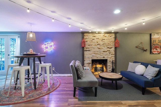 716 S Summerfield Dr, Madison, TN 37115 - living room with wood finished floors, track lighting, and a stone fireplace