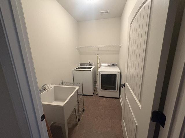 1254 Charleston Blvd, Murfreesboro, TN 37130 - clothes washing area with washing machine and clothes dryer and dark tile patterned floors