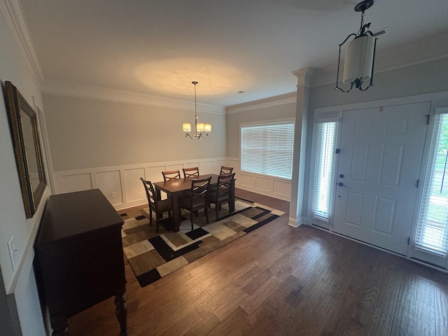 1254 Charleston Blvd, Murfreesboro, TN 37130 - dining area with a chandelier, crown molding, dark wood finished floors, a wainscoted wall, and a decorative wall