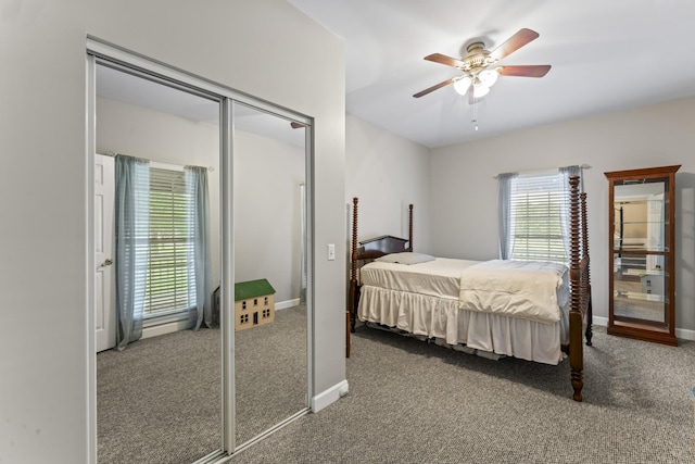 carpeted bedroom with a ceiling fan, baseboards, and a closet
