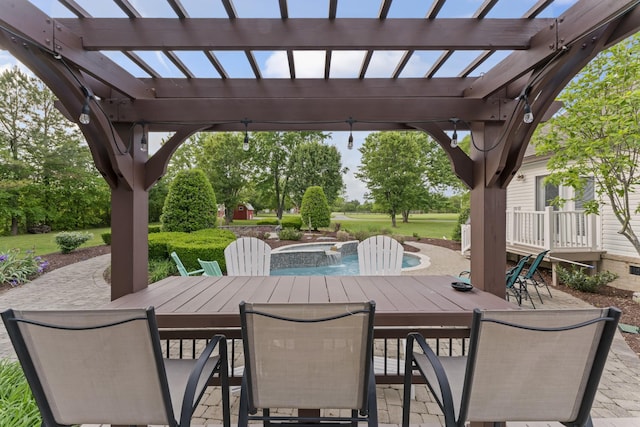 view of patio featuring a pergola and outdoor dining space