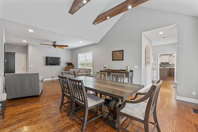 dining area with wood finished floors, beamed ceiling, baseboards, ceiling fan, and recessed lighting