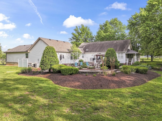 back of house with a lawn and a wooden deck