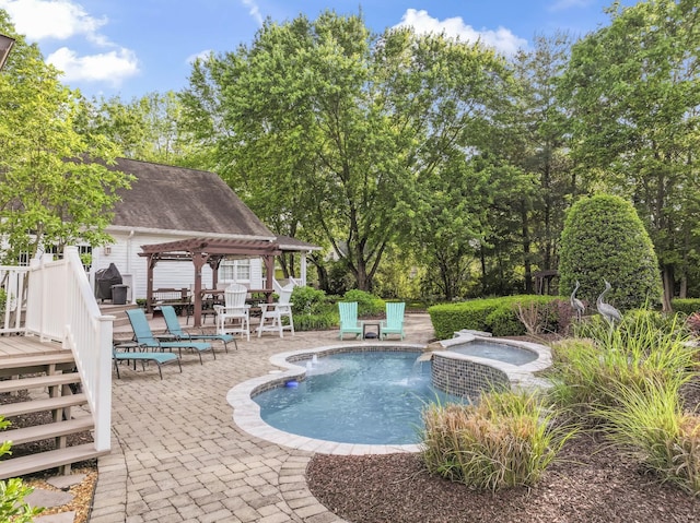 view of swimming pool featuring a wooden deck, a pergola, an in ground hot tub, and a patio area