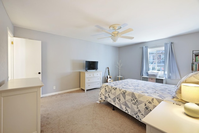 bedroom featuring baseboards, ceiling fan, and light carpet