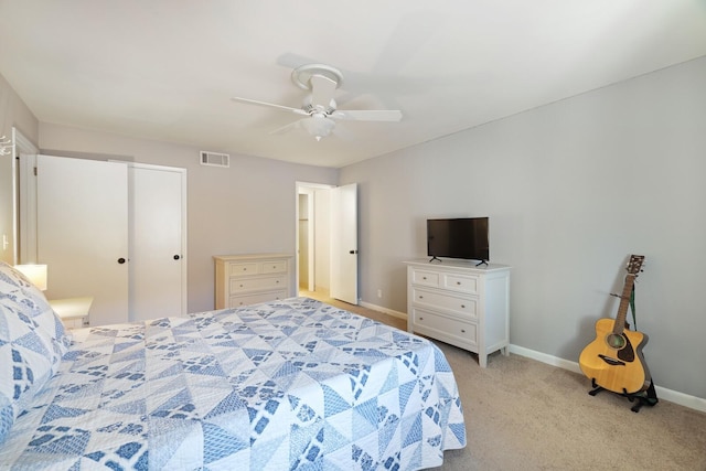 bedroom with visible vents, baseboards, ceiling fan, and light carpet