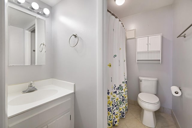 bathroom with tile patterned flooring, vanity, baseboards, toilet, and a shower with shower curtain