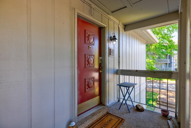 entrance to property featuring a porch