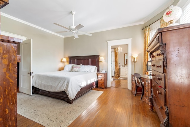 bedroom featuring crown molding, ceiling fan, and hardwood / wood-style floors