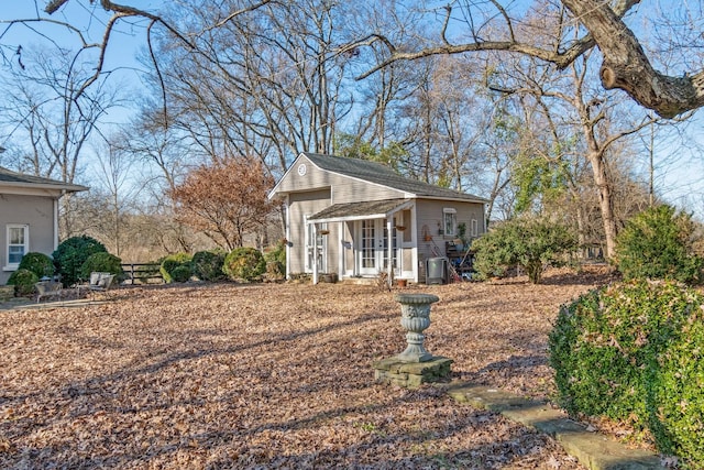 view of property exterior with an outdoor structure