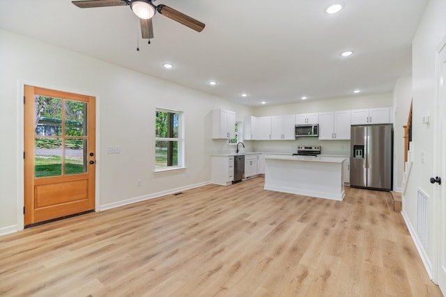 kitchen featuring plenty of natural light, light countertops, recessed lighting, and stainless steel appliances