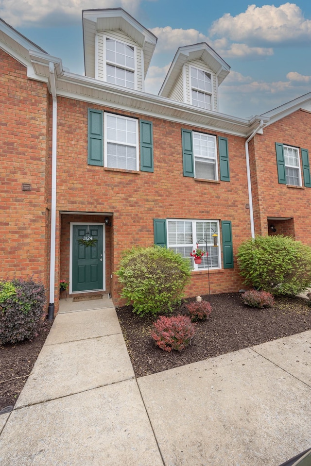 multi unit property featuring brick siding