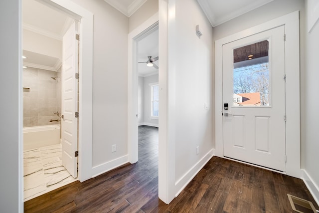 2509B Scovel St, Nashville, TN 37208 - foyer entrance featuring crown molding, baseboards, visible vents, and dark wood-type flooring