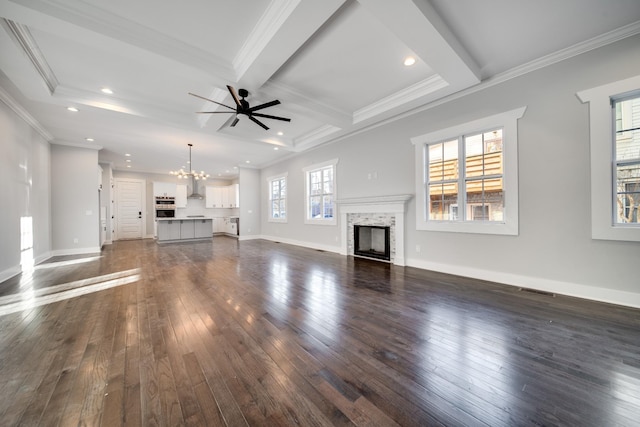 2509B Scovel St, Nashville, TN 37208 - unfurnished living room featuring a fireplace, dark wood finished floors, beamed ceiling, ceiling fan with notable chandelier, and recessed lighting