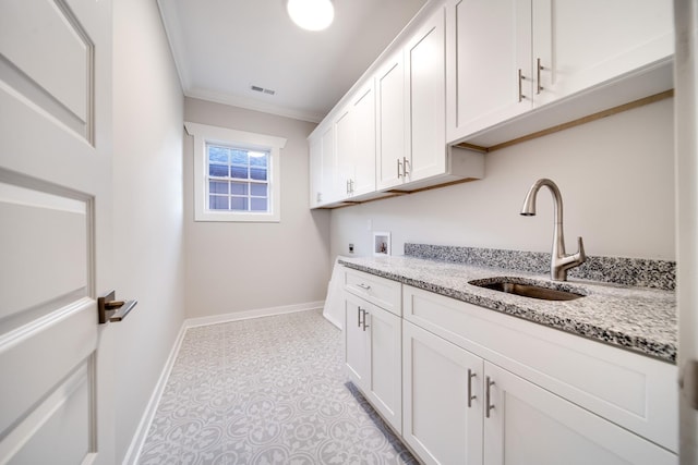 2509B Scovel St, Nashville, TN 37208 - washroom featuring visible vents, ornamental molding, baseboards, hookup for a washing machine, and a sink