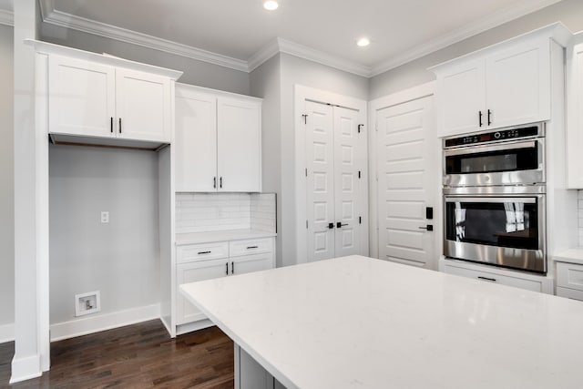2509B Scovel St, Nashville, TN 37208 - kitchen featuring backsplash, stainless steel double oven, baseboards, recessed lighting, and dark wood-type flooring