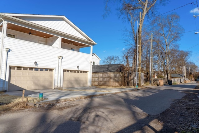 2509B Scovel St, Nashville, TN 37208 - view of side of property featuring an attached garage, a balcony, and driveway
