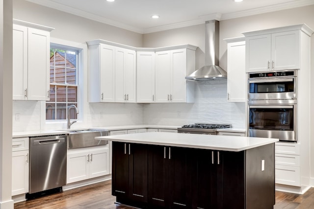 2509A Scovel St, Nashville, TN 37208 - kitchen featuring wall chimney range hood, appliances with stainless steel finishes, light countertops, recessed lighting, and backsplash