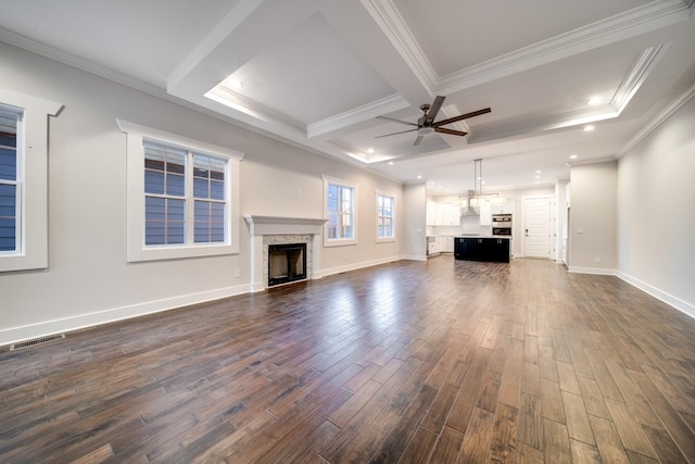 2509A Scovel St, Nashville, TN 37208 - unfurnished living room featuring crown molding, ceiling fan, beam ceiling, a fireplace, and dark wood-style floors