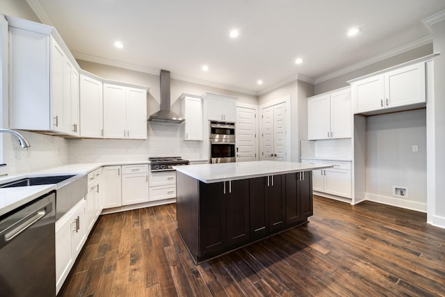 2509A Scovel St, Nashville, TN 37208 - kitchen with a kitchen island, wall chimney range hood, a sink, backsplash, and stainless steel appliances
