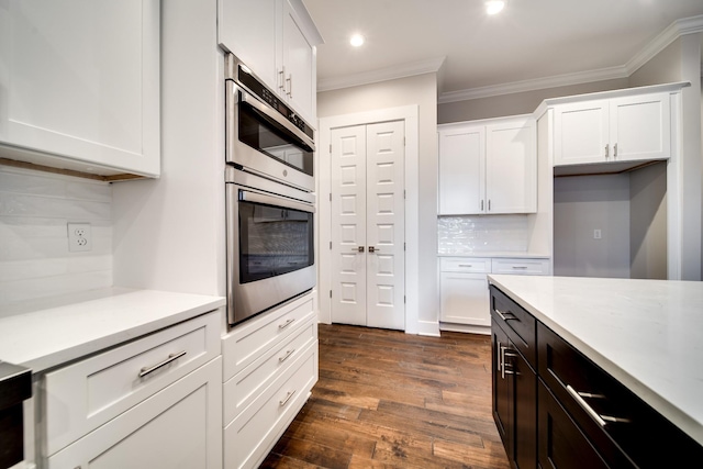 2509A Scovel St, Nashville, TN 37208 - kitchen featuring crown molding, light countertops, white cabinetry, recessed lighting, and backsplash