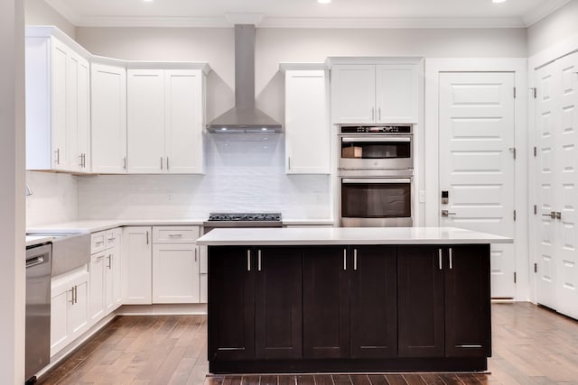 2509A Scovel St, Nashville, TN 37208 - kitchen featuring wall chimney range hood, stainless steel appliances, recessed lighting, and light countertops