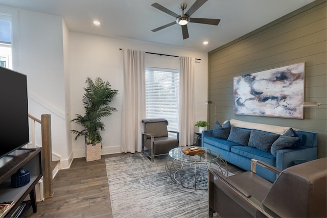 living area with recessed lighting, a ceiling fan, baseboards, and wood finished floors