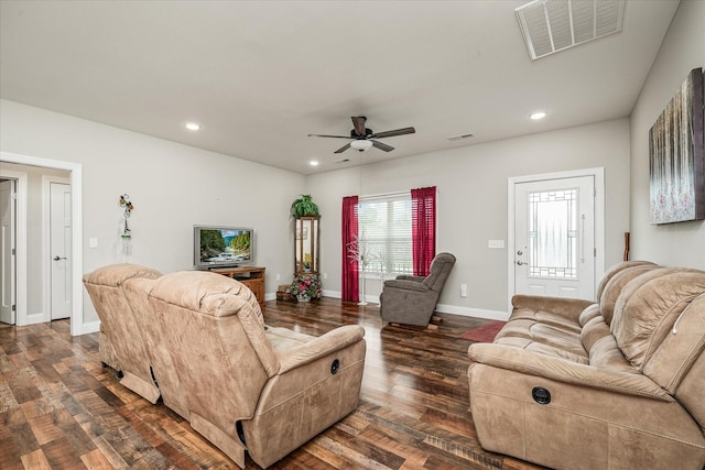 living area featuring a ceiling fan, dark wood-style flooring, visible vents, baseboards, and recessed lighting