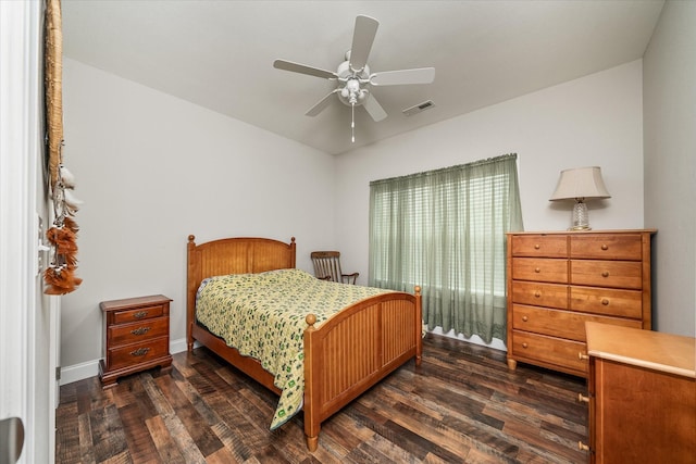 bedroom with baseboards, a ceiling fan, dark wood-style floors, and visible vents
