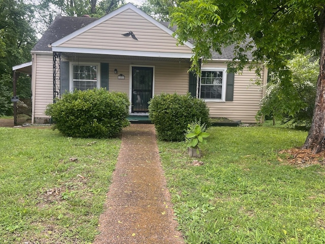 1801 24th Ave N, Nashville, TN 37208 - bungalow-style house featuring a porch, a shingled roof, and a front yard
