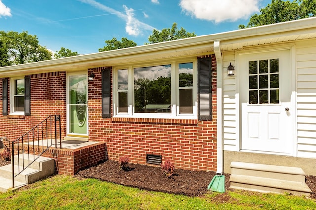 154 Church Ave, Watertown, TN 37184 - view of exterior entry with brick siding and crawl space