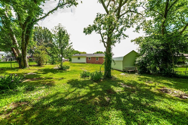 154 Church Ave, Watertown, TN 37184 - view of yard with an outdoor structure, fence, and a shed