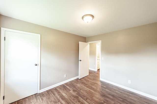 154 Church Ave, Watertown, TN 37184 - unfurnished bedroom featuring wood finished floors and baseboards