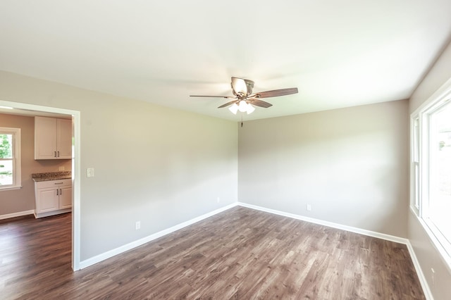 154 Church Ave, Watertown, TN 37184 - unfurnished room with baseboards, a ceiling fan, and dark wood-style floors