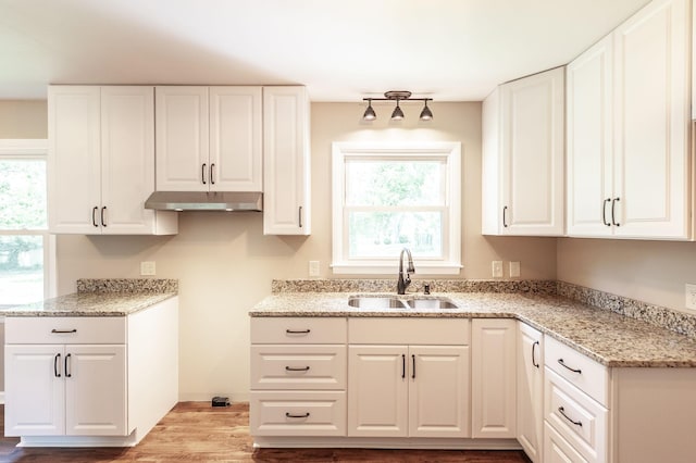 154 Church Ave, Watertown, TN 37184 - kitchen featuring under cabinet range hood, white cabinetry, light stone countertops, and a sink