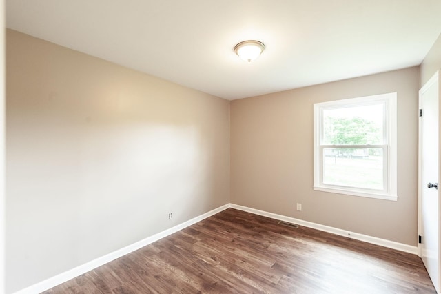 154 Church Ave, Watertown, TN 37184 - unfurnished room featuring baseboards, visible vents, and dark wood finished floors