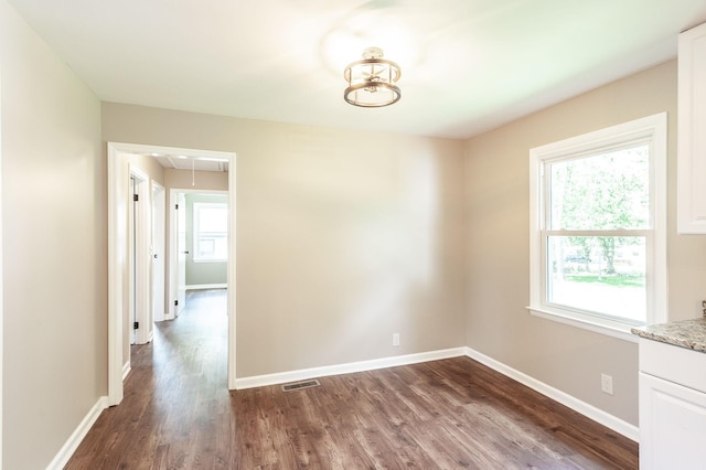 154 Church Ave, Watertown, TN 37184 - unfurnished dining area with baseboards, visible vents, attic access, and dark wood-type flooring