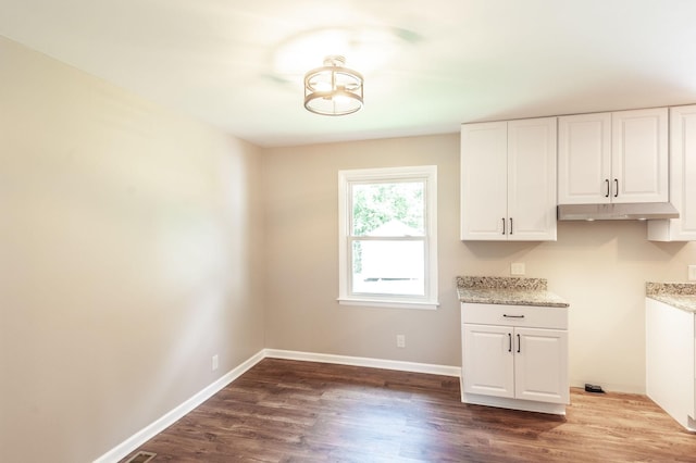 154 Church Ave, Watertown, TN 37184 - kitchen with baseboards, light stone counters, white cabinets, and dark wood-style floors