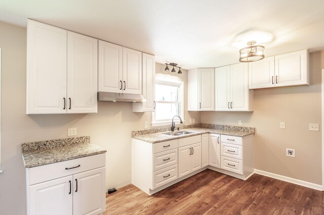 154 Church Ave, Watertown, TN 37184 - kitchen with white cabinetry, wood finished floors, and a sink