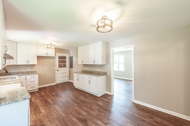 154 Church Ave, Watertown, TN 37184 - kitchen featuring baseboards, white cabinets, and dark wood-style floors